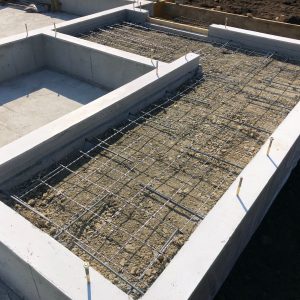 Cement,Foundation,Of,House,In,Construction,Site,On,Land.,The